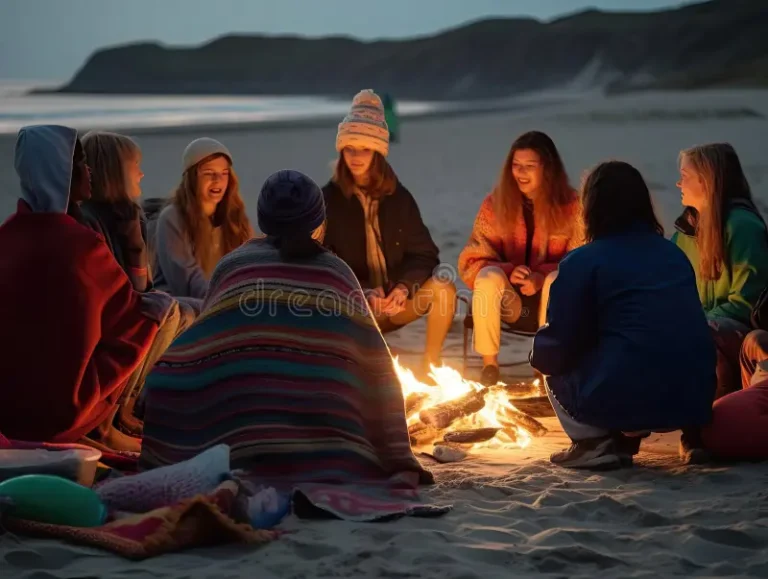 vibrant-glow-bonfire-illuminates-night-as-diverse-group-gen-zers-huddle-together-sandy-beach-colorful-blankets-adorn-281555871.jpg